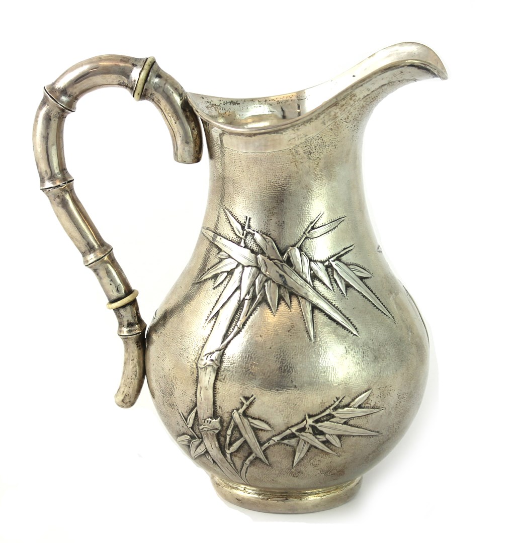 Appraisal: A Chinese jug with an insulated bamboo handle the body