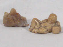 Appraisal: Two Chinese hard stone carvings each of a reclining figure