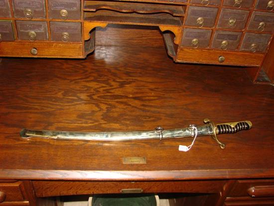 Appraisal: JAPANESE SWORD Single edge sword '' with brass hilt and