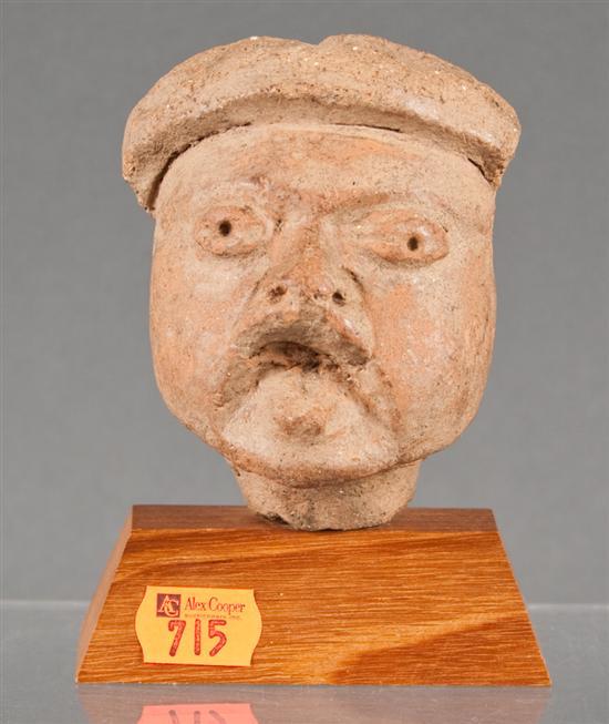 Appraisal: Pre-Colombian terracotta head possibly Olmec in H with a wooden