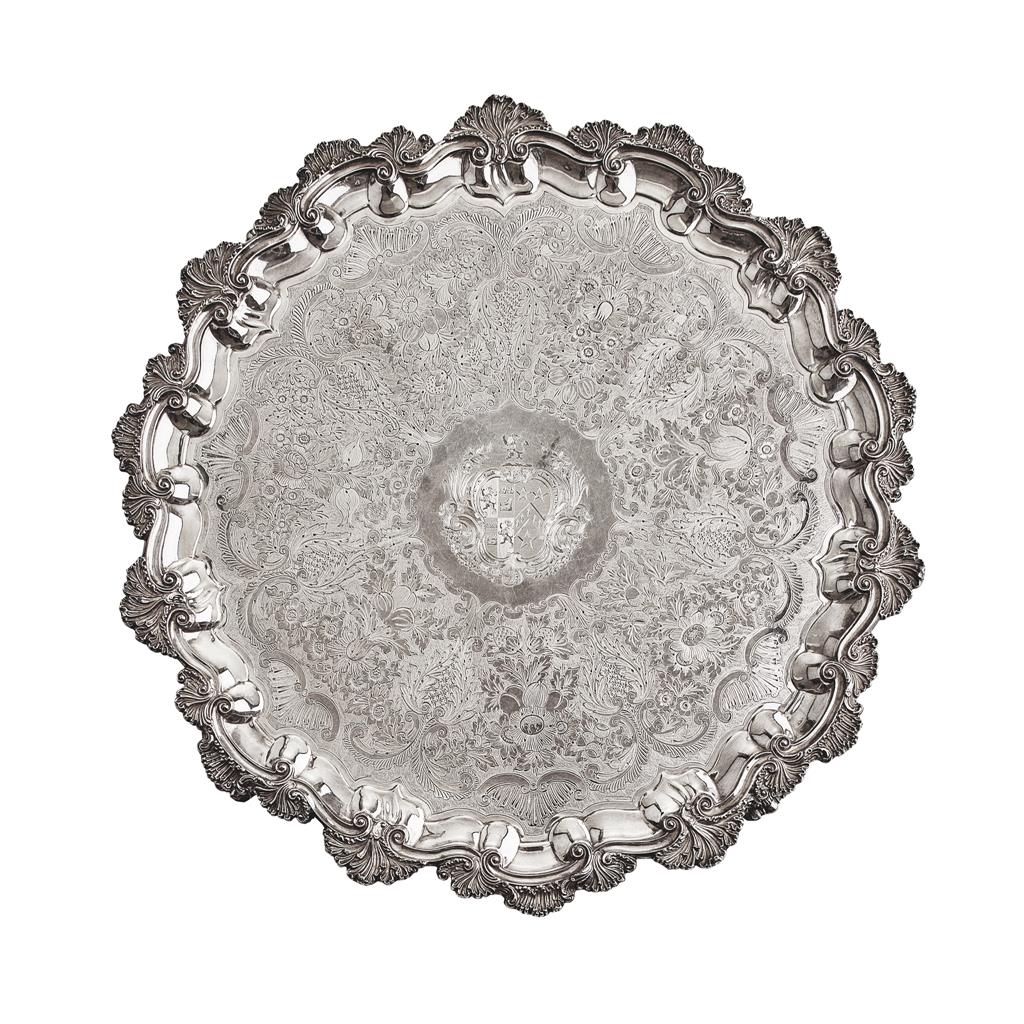 Appraisal: A large Sheffield plate salver the bold rococco border of