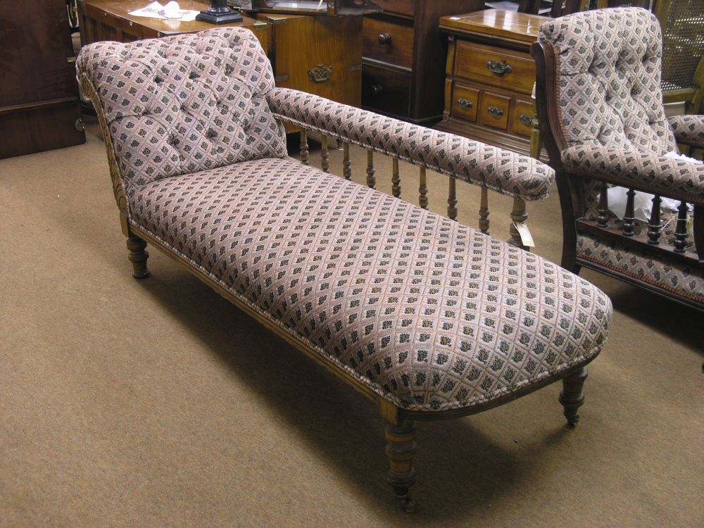 Appraisal: A Victorian walnut framed chaise longue upholstered in a stamped