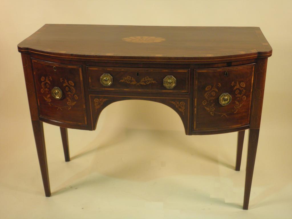 Appraisal: A George III mahogany bow fronted sideboard stamped Edwards and