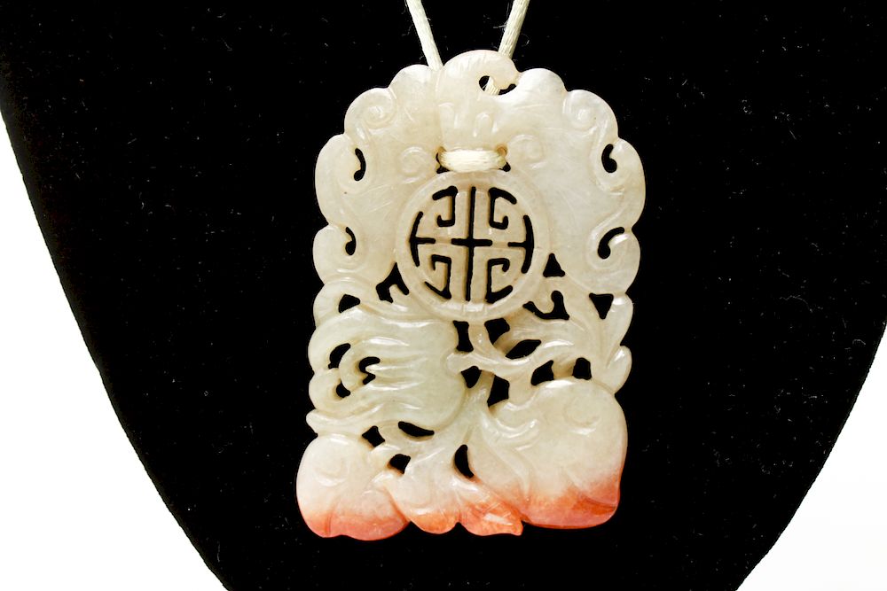 Appraisal: Chinese Celadon Russet Jade Openwork Pendant Chinese celadon and russet