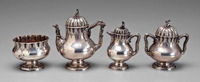 Appraisal: Four-piece sterling tea service pear-shaped with melon-form rims Asian figural