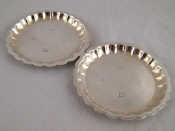 Appraisal: A pair of silver coasters Birmingham wt g