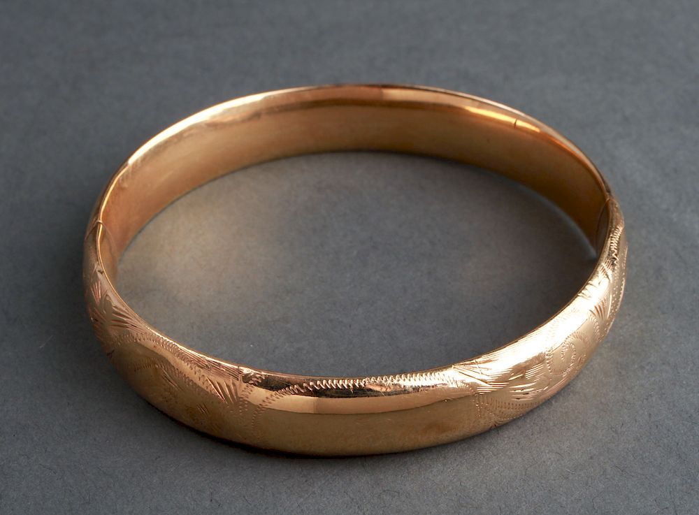 Appraisal: K Yellow Gold Engraved Bangle Hinged Bracelet K yellow gold