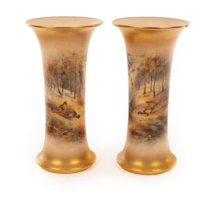 Appraisal: A pair of Royal Worcester waisted cylindrical vases painted pheasants