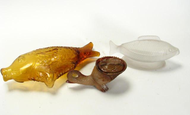 Appraisal: Group of Fish Motif Glass items including amber fish bottle