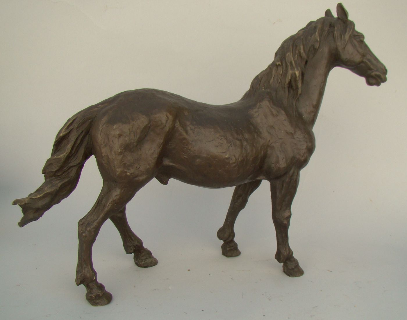 Appraisal: BRONZE FIGURE OF A STALLION th CenturyWith nut-brown patina Height