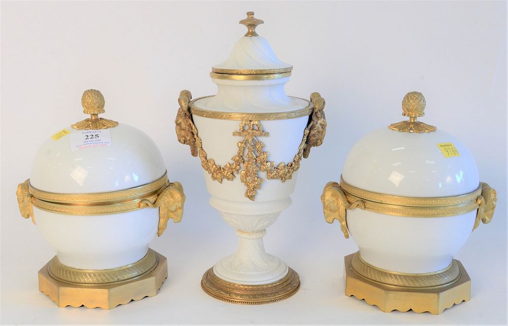 Appraisal: Three French Porcelain Covered Urns with gilt bronze mounts and