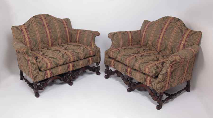 Appraisal: PAIR OF CHIPPENDALE STYLE SETTEES Flemish mahogany legs and stretchers