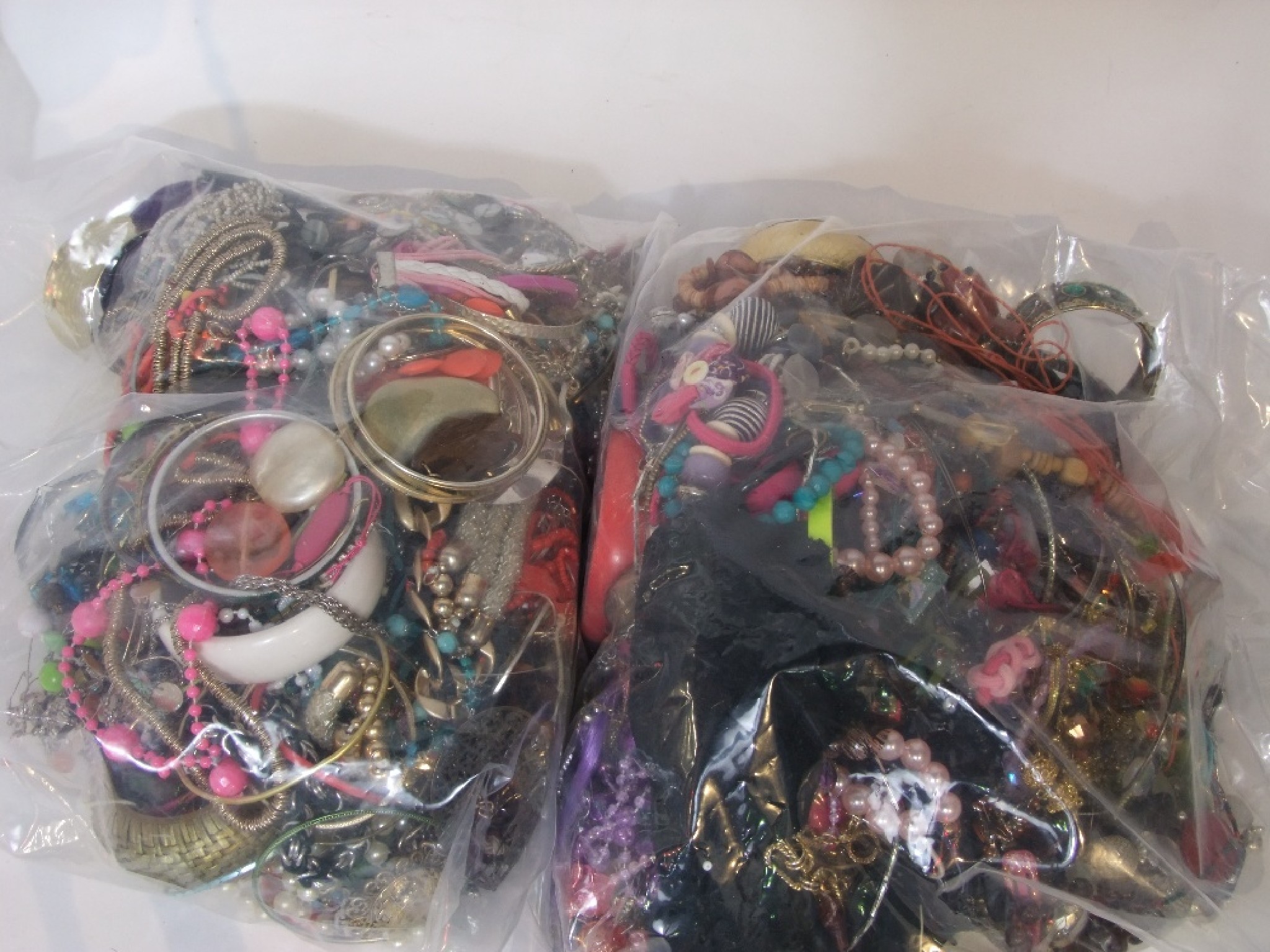 Appraisal: Two sealed bags of costume jewellery kg approx