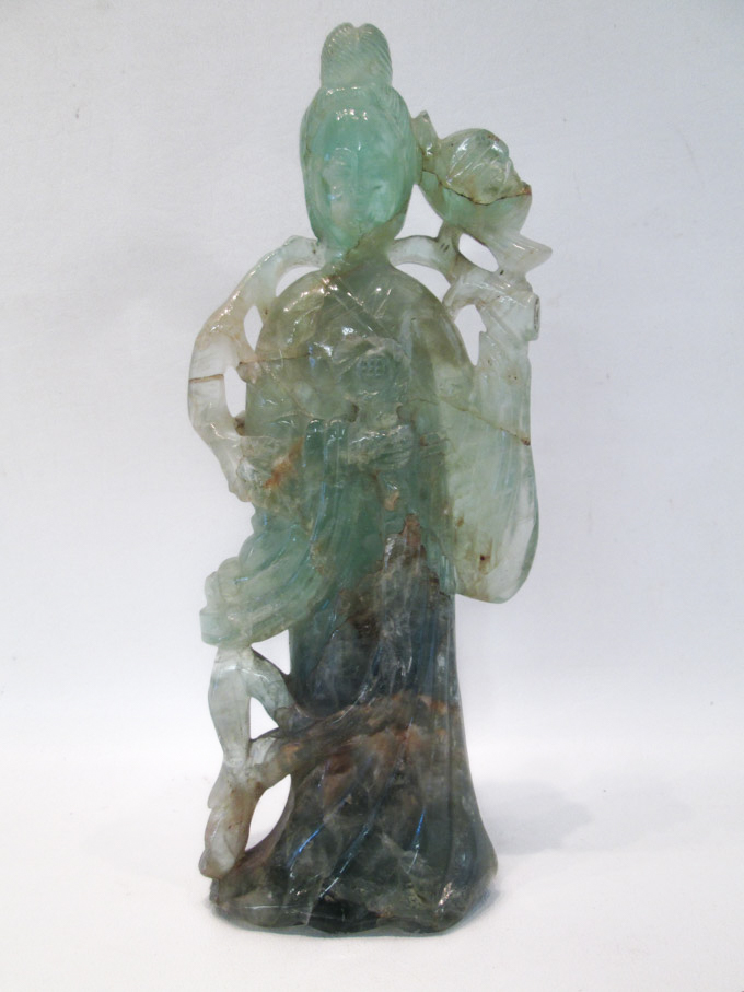 Appraisal: CHINESE GREEN TOURMALINE SCULPTURE of Guanyin standing figure with flowering