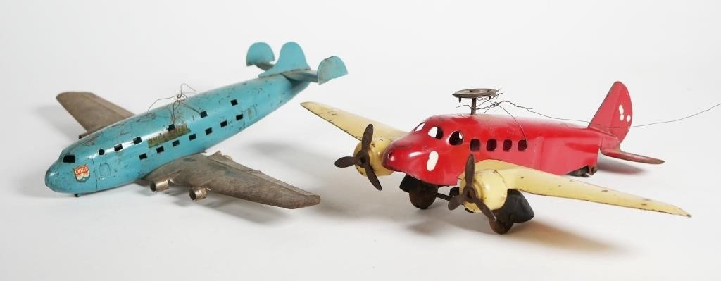 Appraisal: VINTAGE METAL AIRPLANESTwo vintage pressed steel airplane models red plane