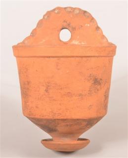 Appraisal: Antique Unglazed Redware Wall Vase Arched back with pinched rim