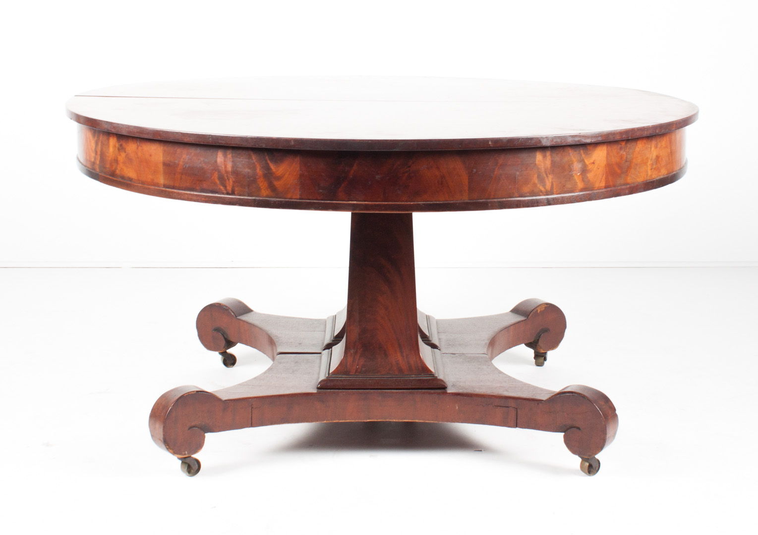 Appraisal: American Restoration mahogany dining table circa circular form double pedestal