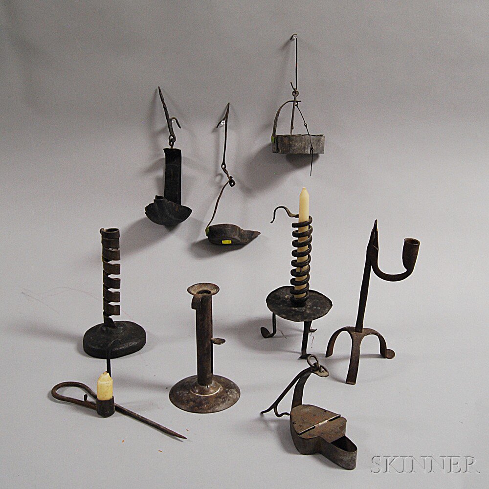 Appraisal: Nine Pieces of Early Iron Lighting a crusie grease lamp