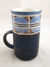 Appraisal: Troika A mug with broad top blue band over dark