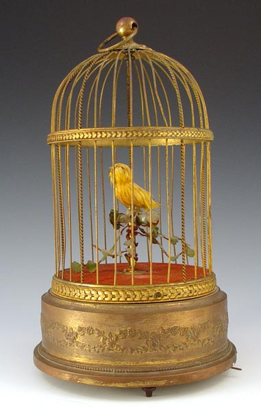 Appraisal: FRENCH SINGING BIRD AUTOMATON Single automated and chirping yellow feathered