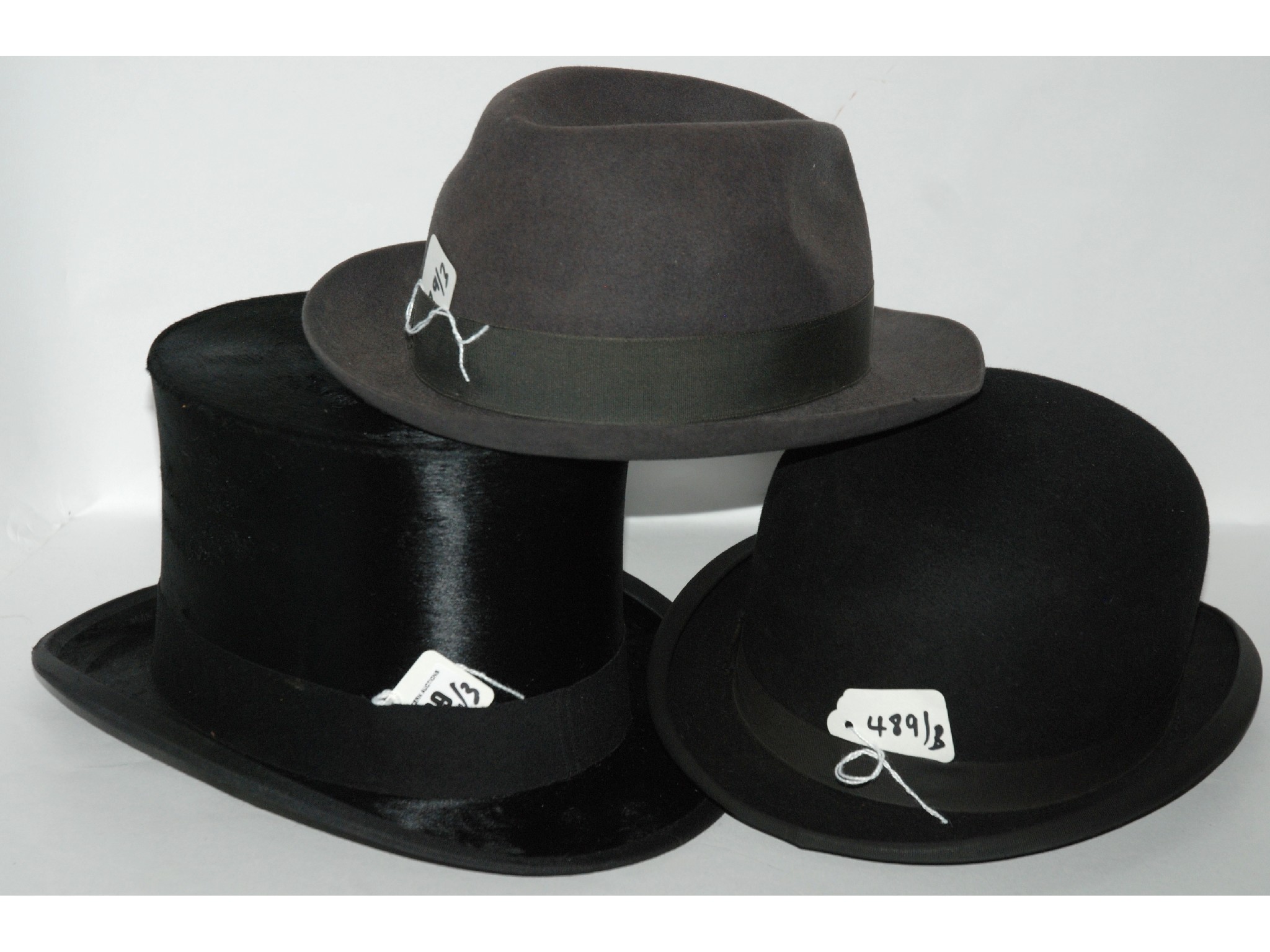 Appraisal: A Carswell black silk top hat a bowler hat and