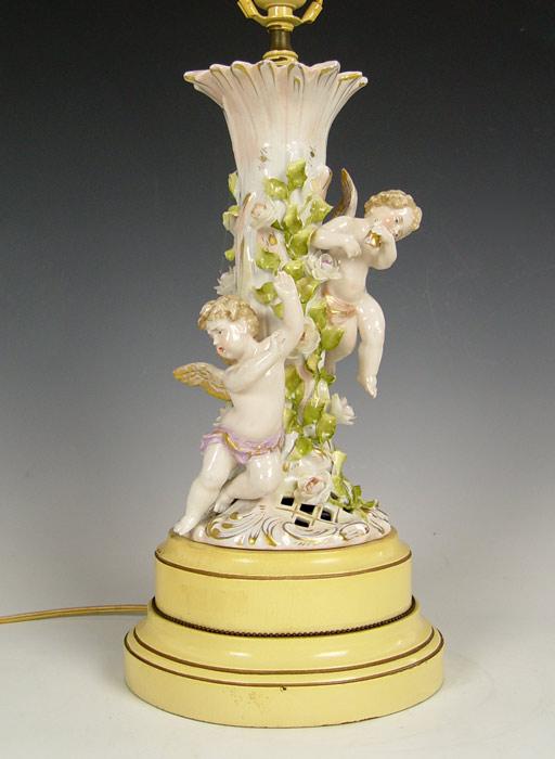 Appraisal: SCHIERHOLZ GERMAN PORCELAIN WINGED CHERUB DECORATED LAMP Blue underglaze crossed