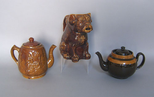 Appraisal: Three pottery pitchers to include Bennington type figural of a