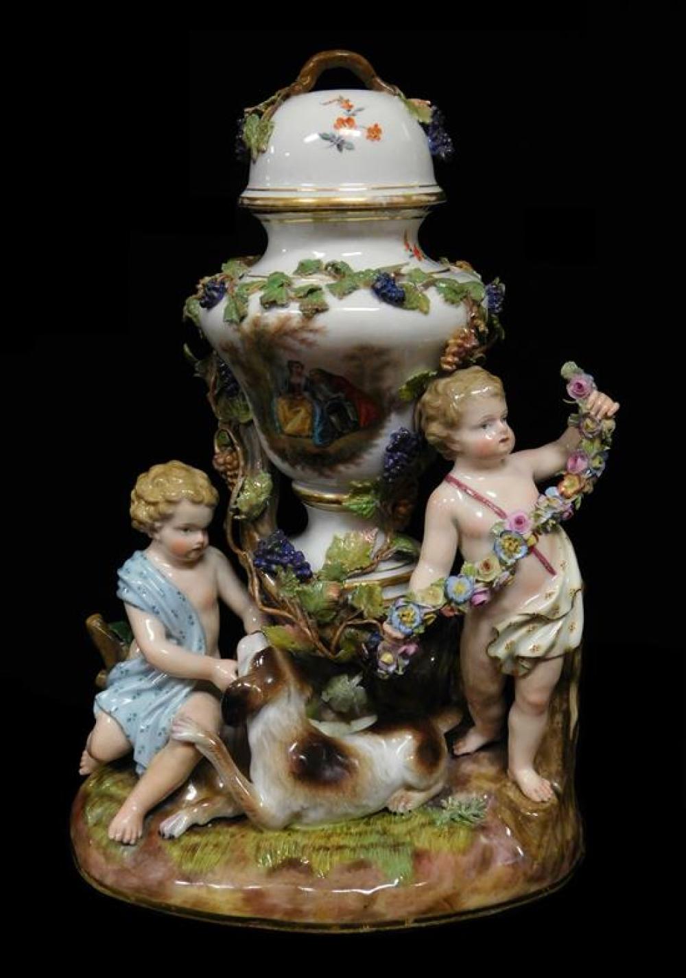 Appraisal: Meissen porcelain figurine covered urn at the center of two