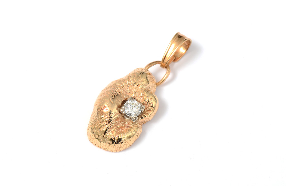 Appraisal: FREE FORM DIAMOND PENDANT K yellow gold diamond pendant contains