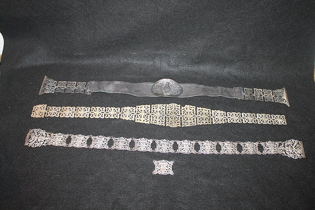 Appraisal: THREE VARIOUS EPNS BELTS with pierced decoration