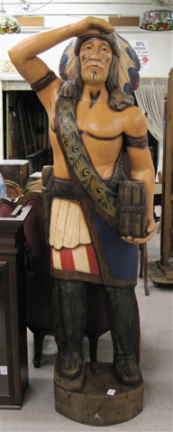 Appraisal: A CARVED AND PAINTED WOOD CIGAR STORE INDIAN the larger-than-life-size