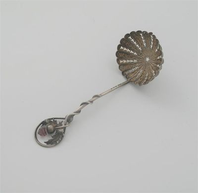 Appraisal: A small Edwardian sugar sifter ladle with thistle terminal set