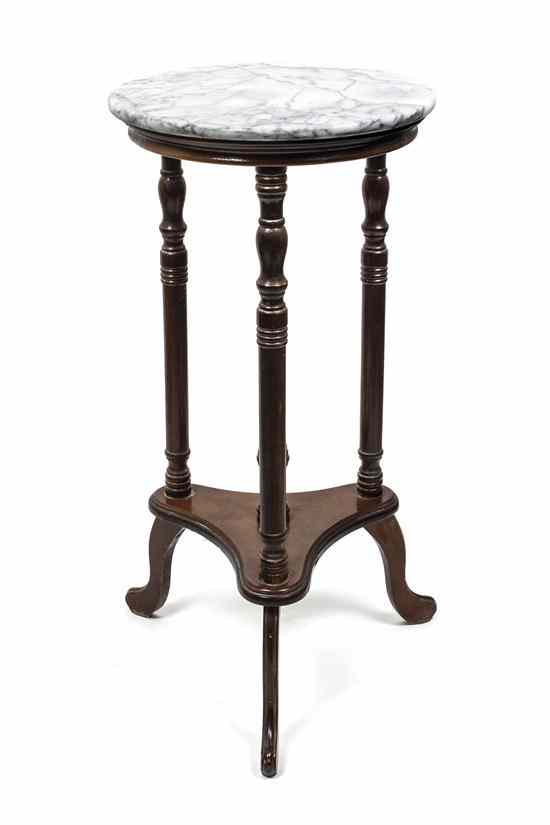 Appraisal: A Marble Top Side Table having a circular mottled white