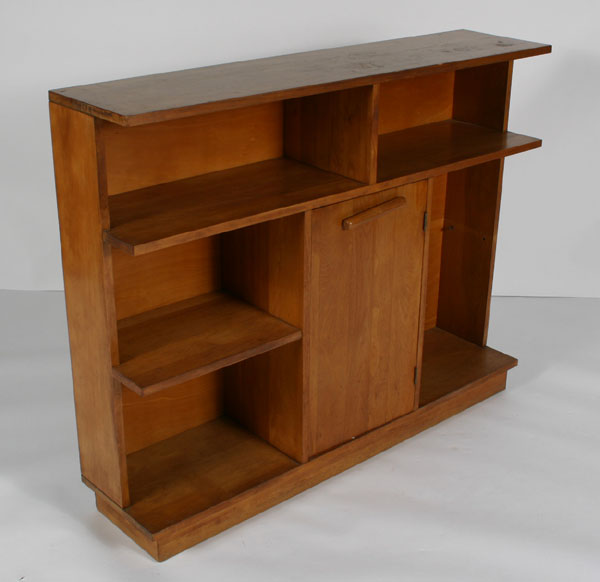 Appraisal: Hollywood Regency style open bookcase with center door and four