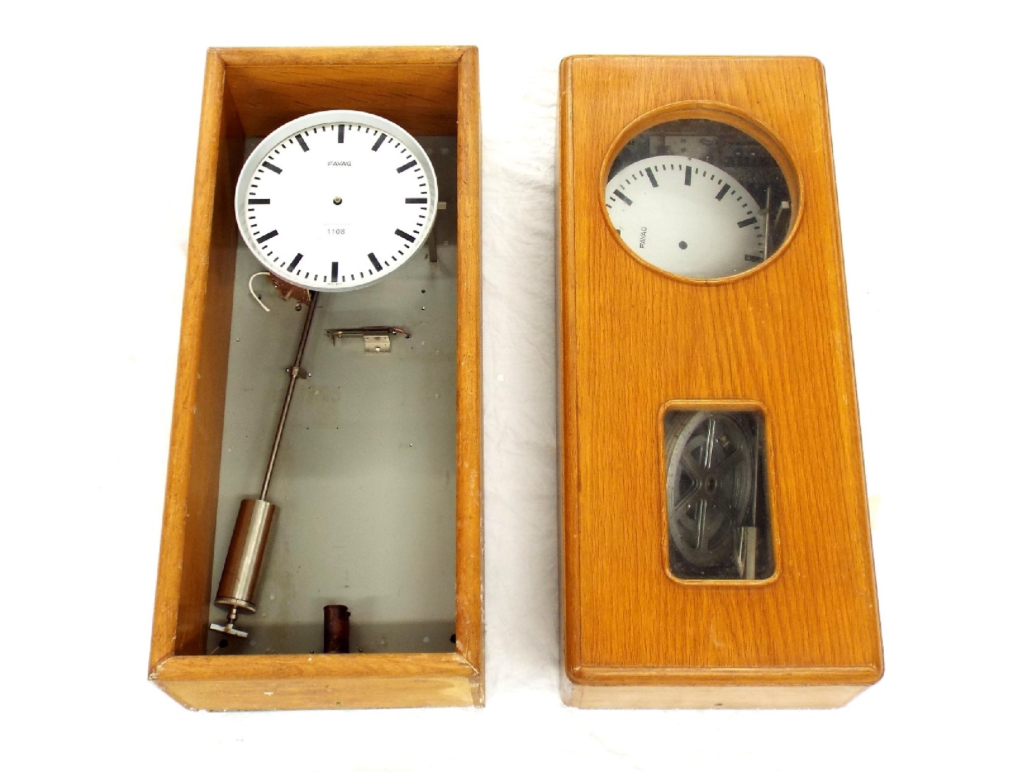 Appraisal: Two Favag electric master clocks for spares repair each in