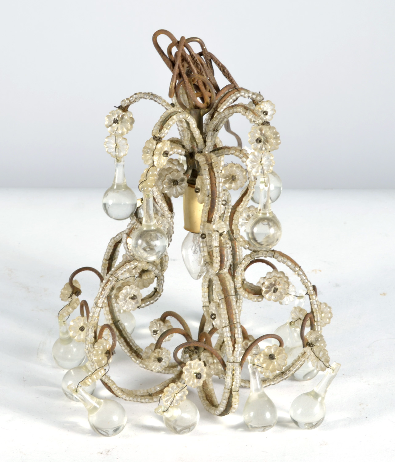 Appraisal: HANGING CRYSTAL LAMP with ball-form drops and scrolled foliate design