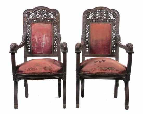 Appraisal: A Pair of Renaissance Revival Carved Open Armchairs each having