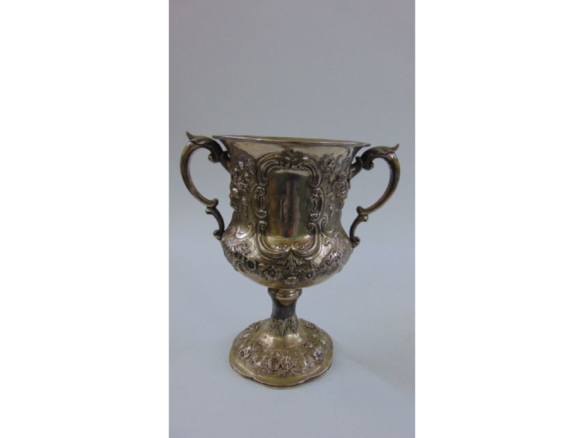 Appraisal: A Victorian embossed silver trophy shaped vase with floral 'c'