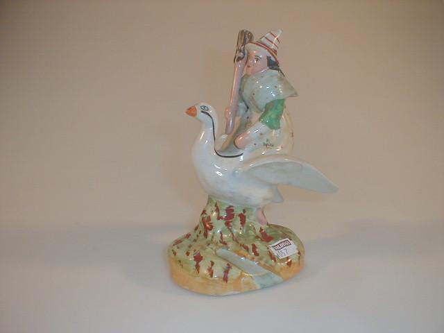 Appraisal: A Staffordshire type pottery figure of a witch riding on