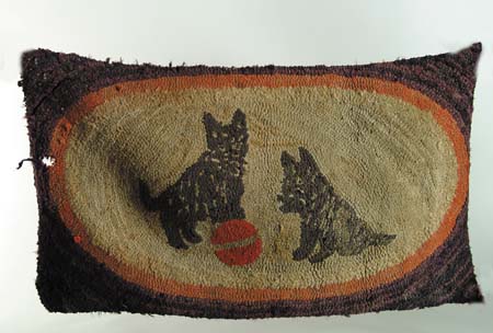 Appraisal: SCOTTIE DOG HOOKED RUG Oval central cream field with two