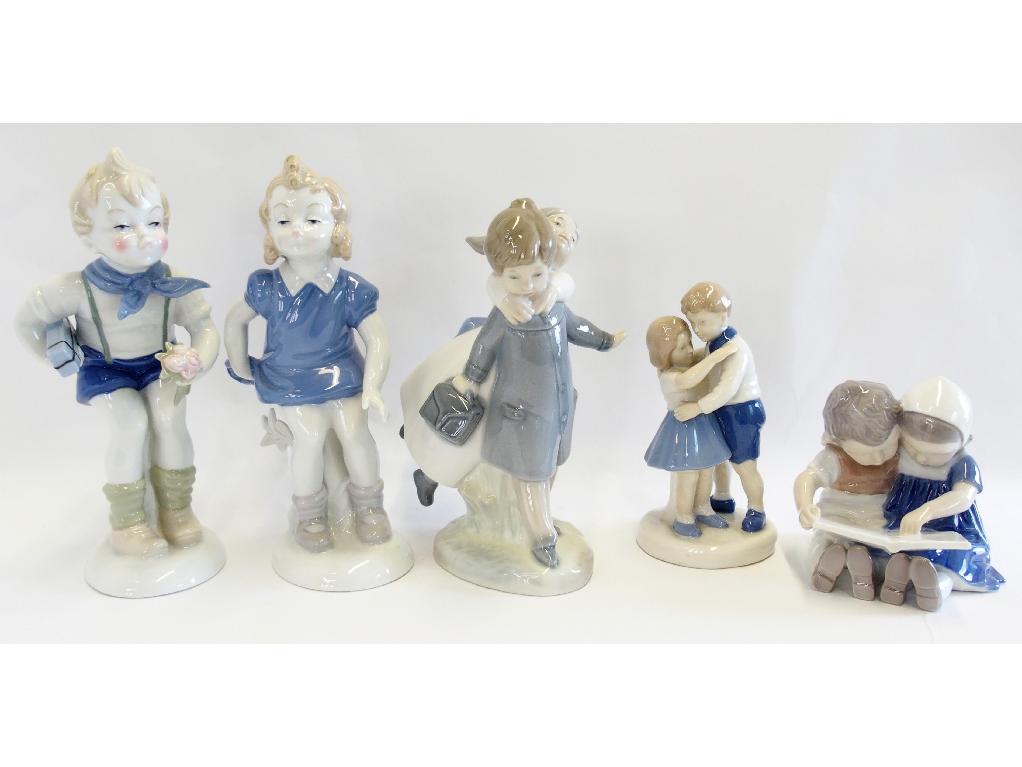 Appraisal: Four Danish and one Spanish porcelain figure