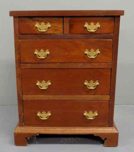 Appraisal: Miniature Chippendale style cherry highcase with straight bracket feet h