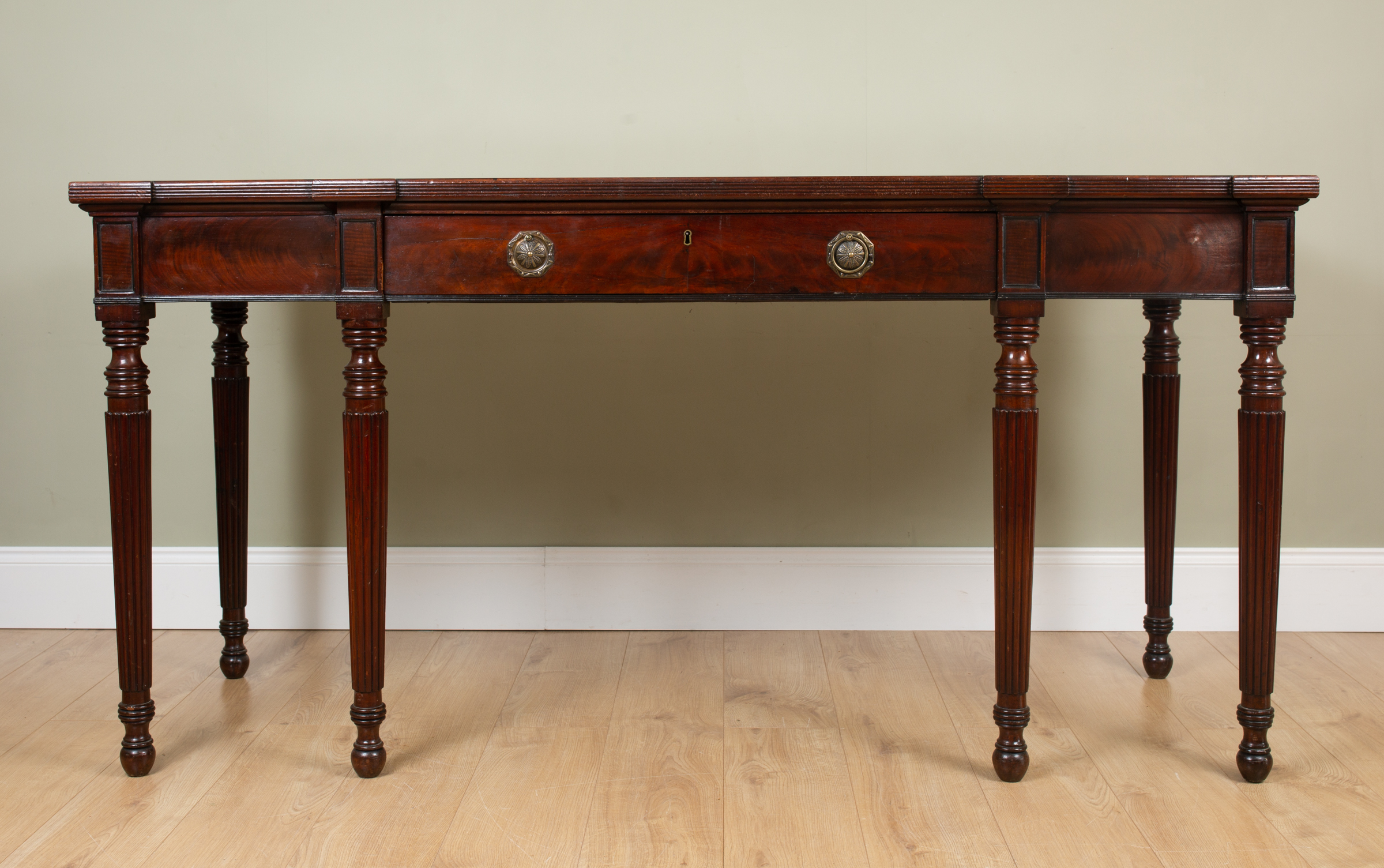 Appraisal: An early Victorian mahogany break front serving table with single