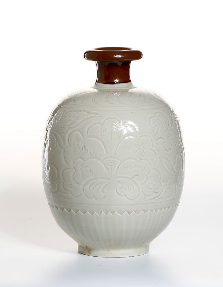 Appraisal: Rare Brown-Slip Decorated White Ding Ovoid Vase The rounded ovoid