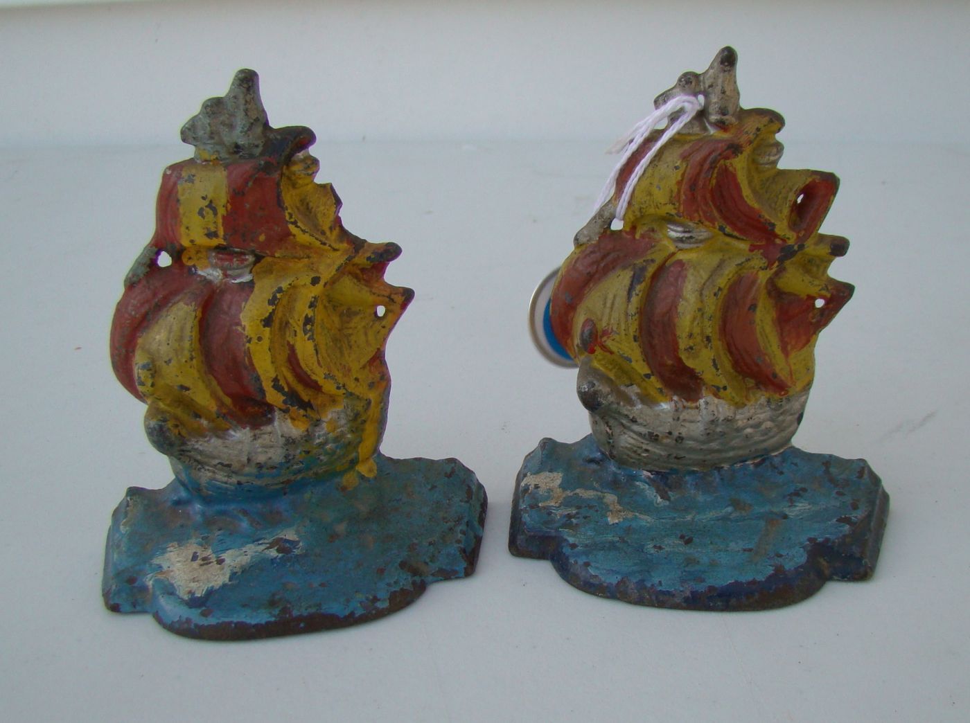 Appraisal: PAIR OF PAINTED CAST IRON BOOKENDS In the form of