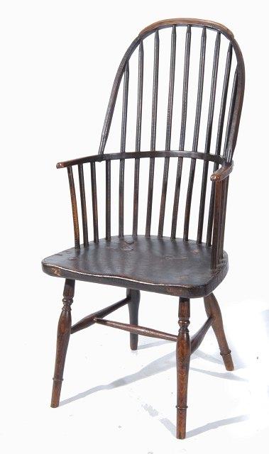 Appraisal: An antique ash and elm spindle back Windsor armchair with