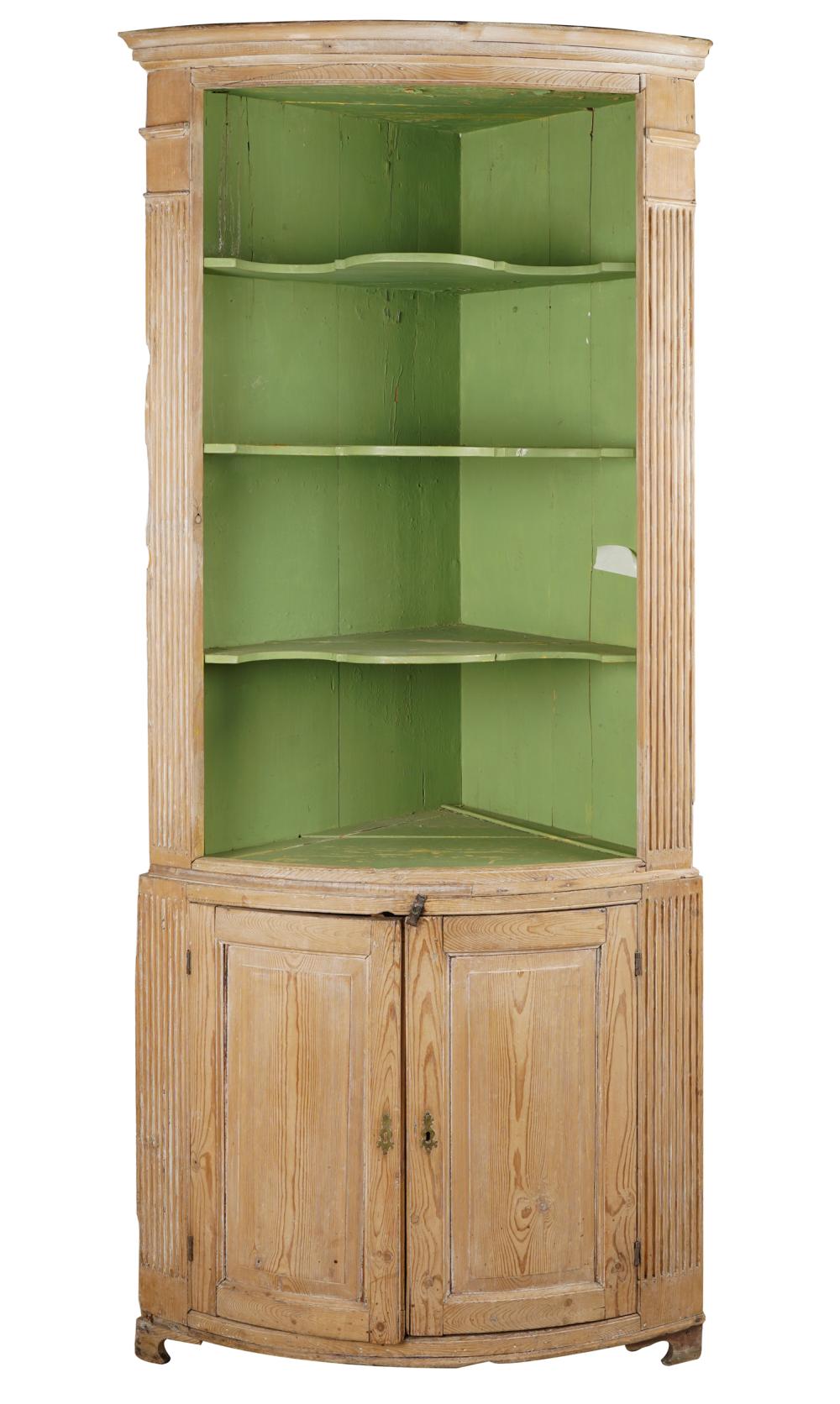 Appraisal: NEOCLASSICAL-STYLE PINE CORNER CABINETin two parts with curved front the