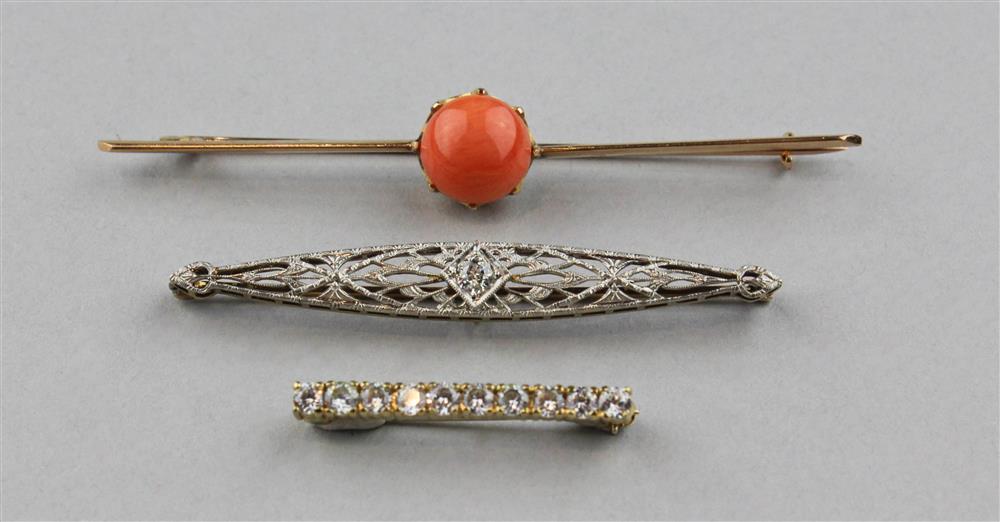 Appraisal: THREE LADY'S BAR PINS the first an elongated silver-topped navette