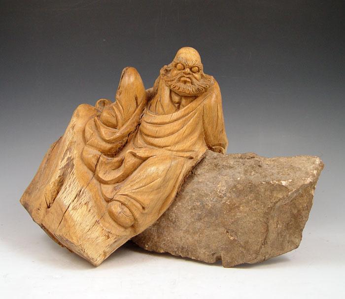 Appraisal: CHINESE STONE AND CARVED WOOD SHIH KO The Demon Quellar