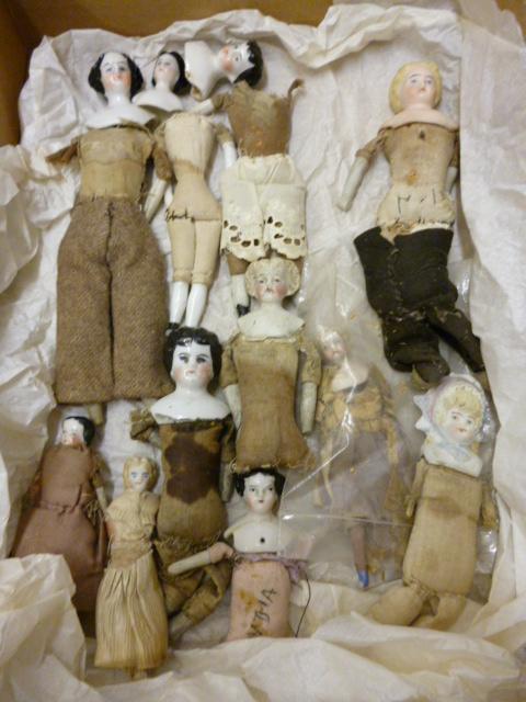 Appraisal: A collection of eleven th century doll's house dolls of